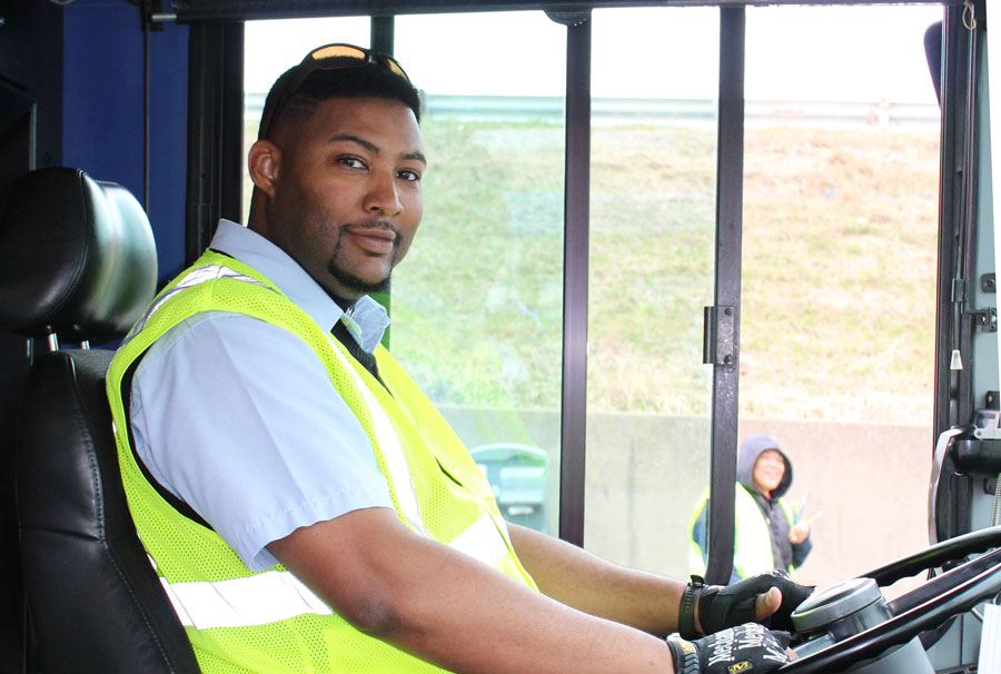 Bus driver at the wheel.